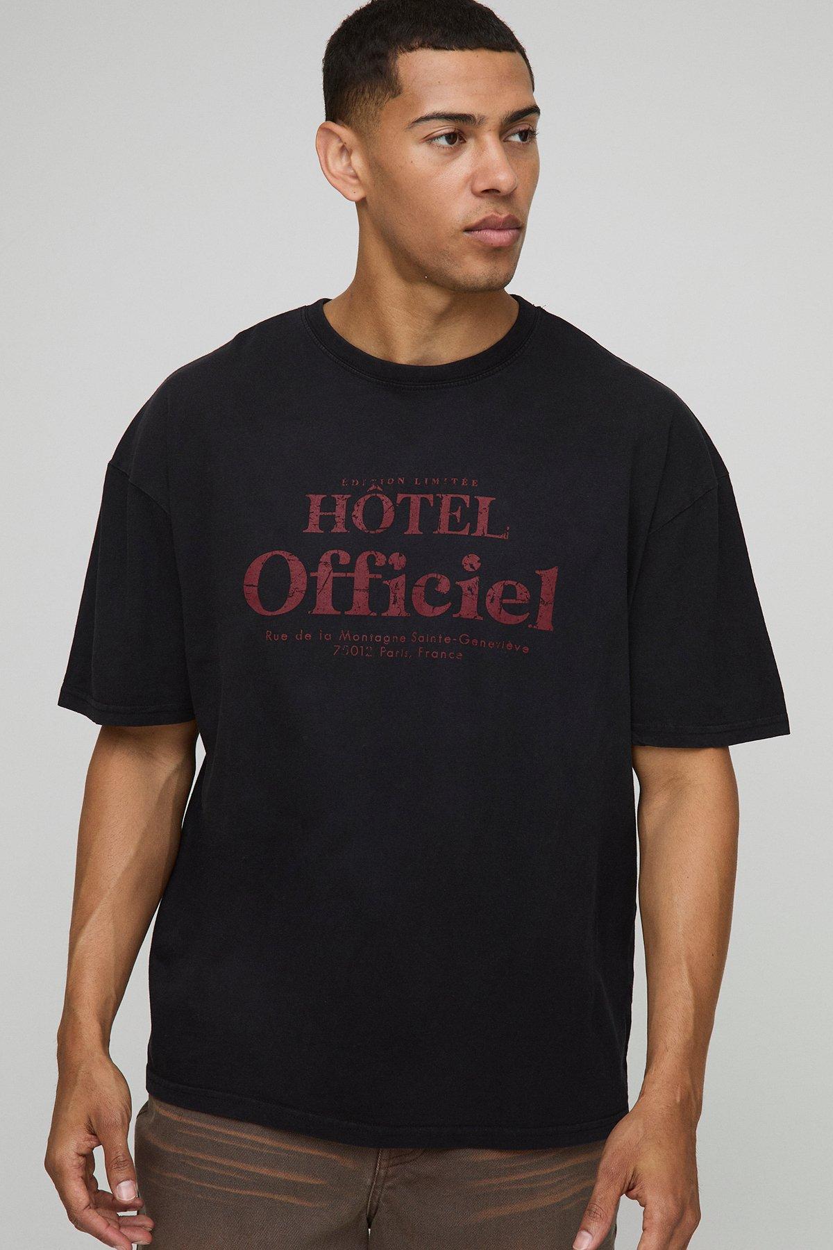 Image of T-shirt oversize nera slavata con stampa Official Hotel, Nero