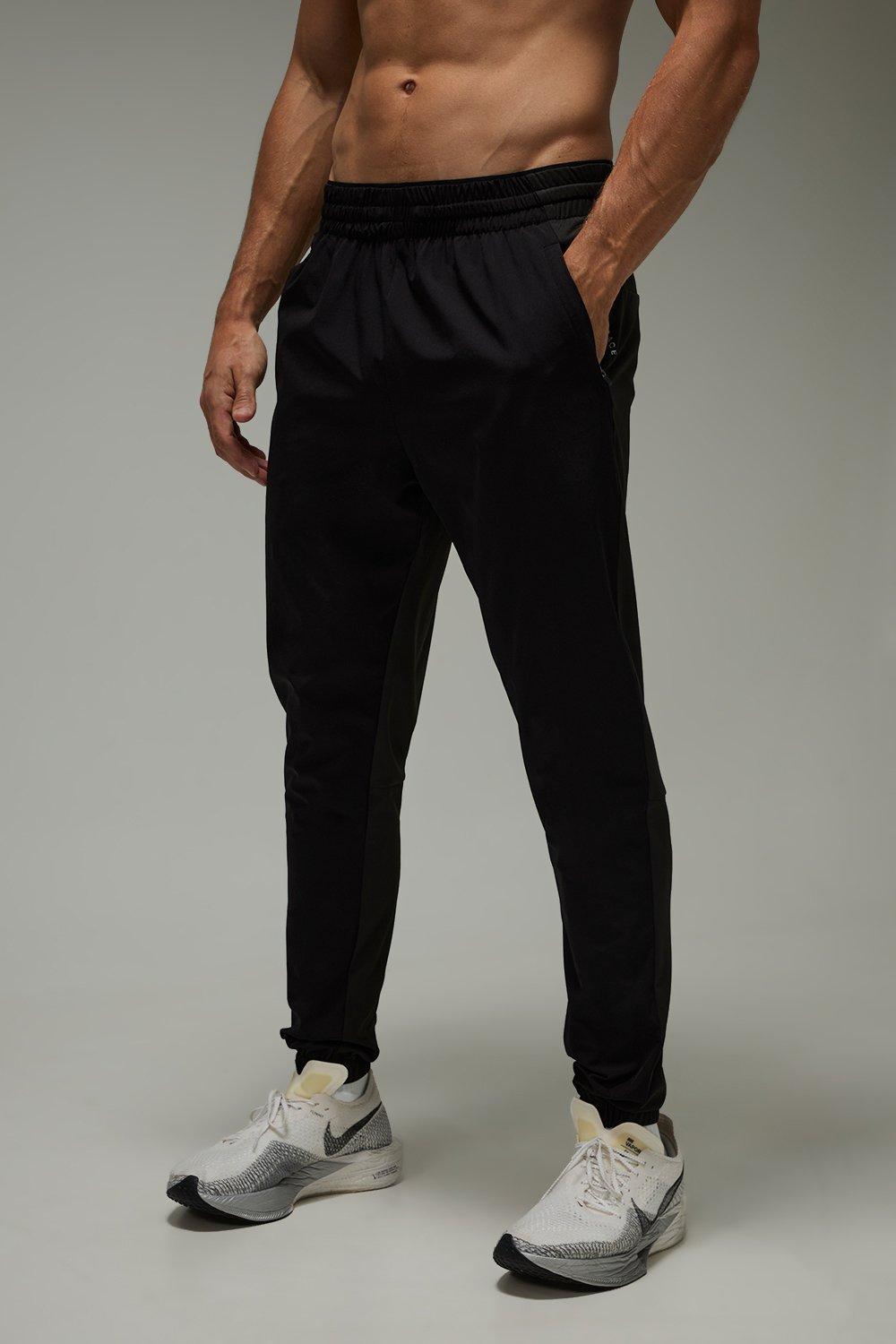 Mens Black Common Pace Running Ultra Stretch Tapered Jogger, Black
