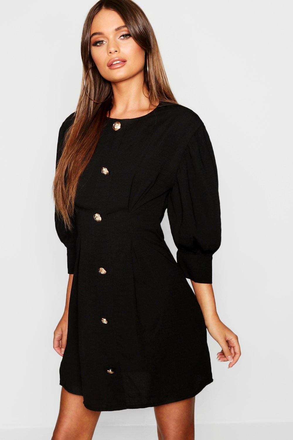 black dress with gold buttons