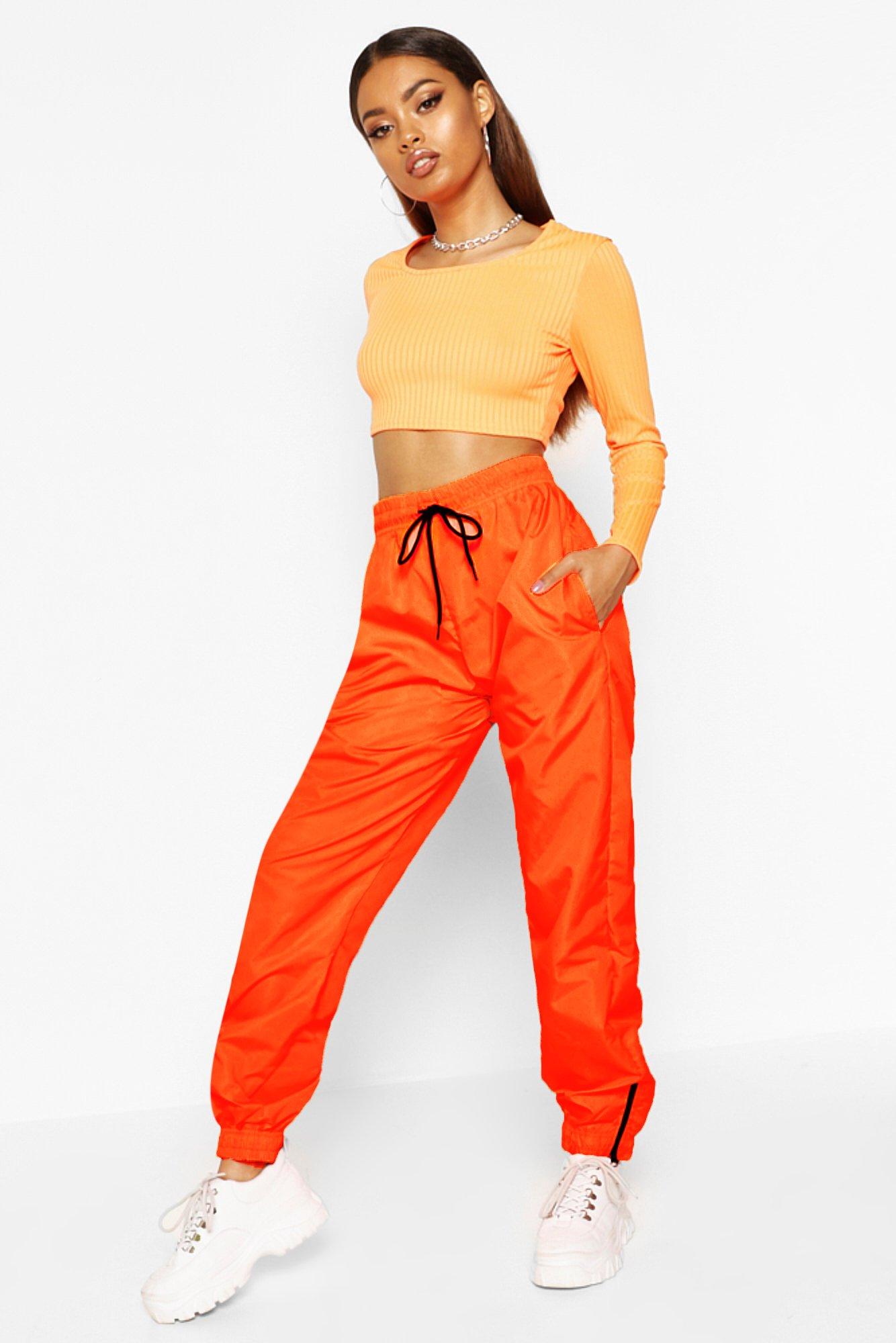 orange high waisted trousers