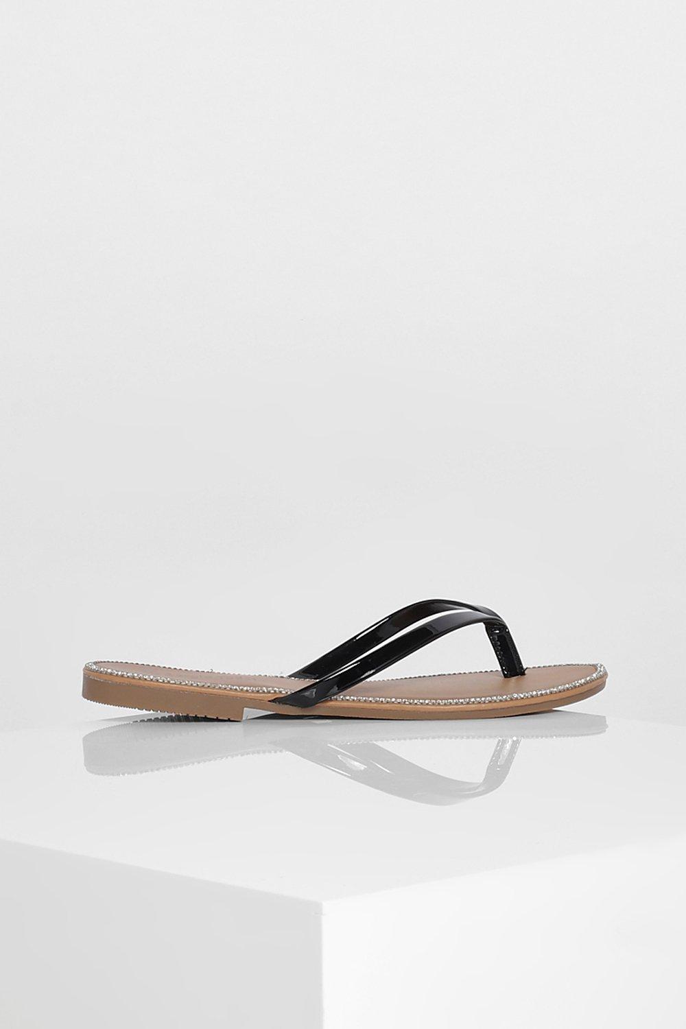 black embellished flip flops