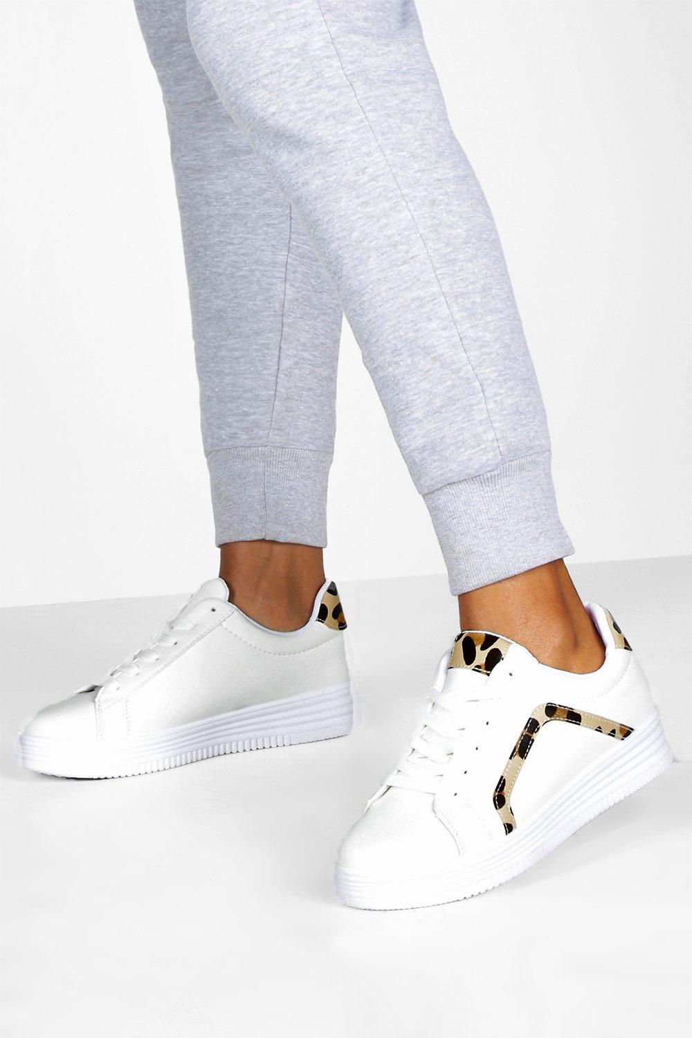 white flat trainers uk