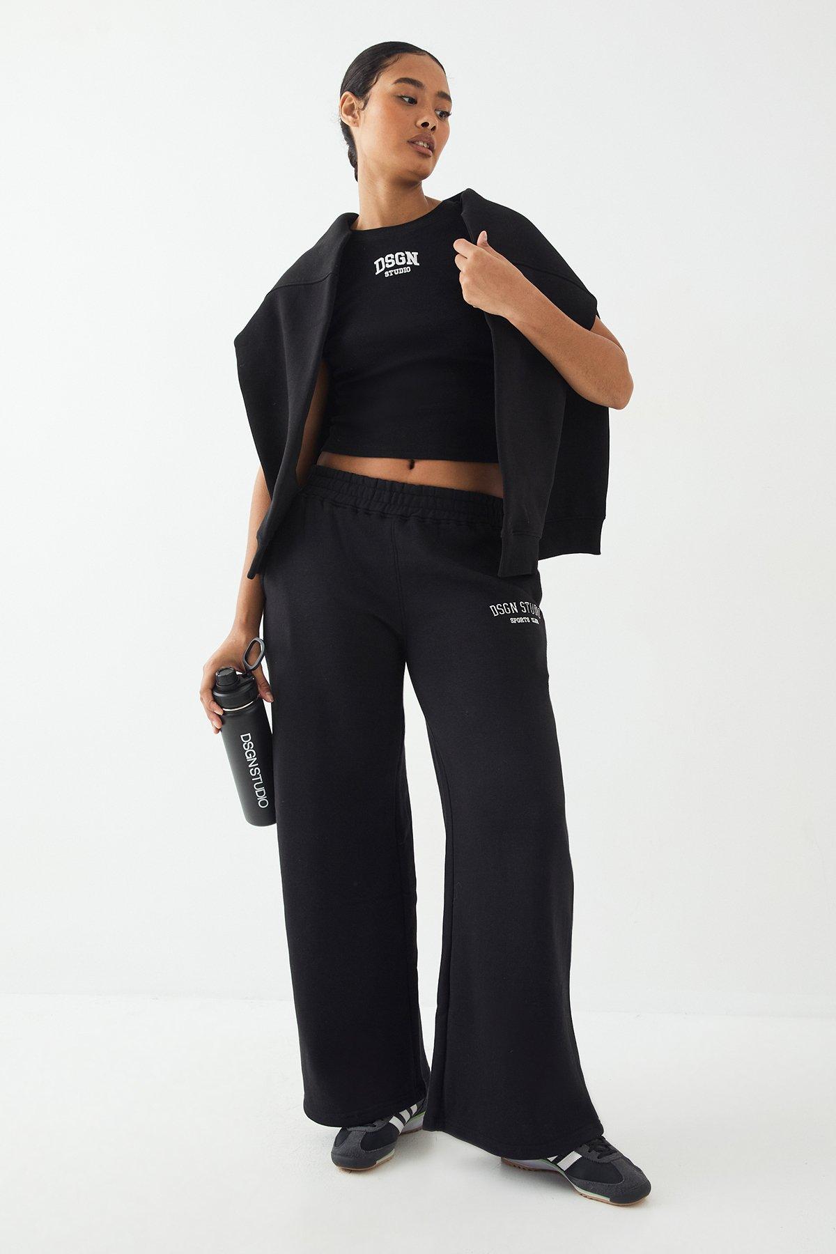 Image of Pantaloni tuta dritti con applique Dsgn Studio, Nero