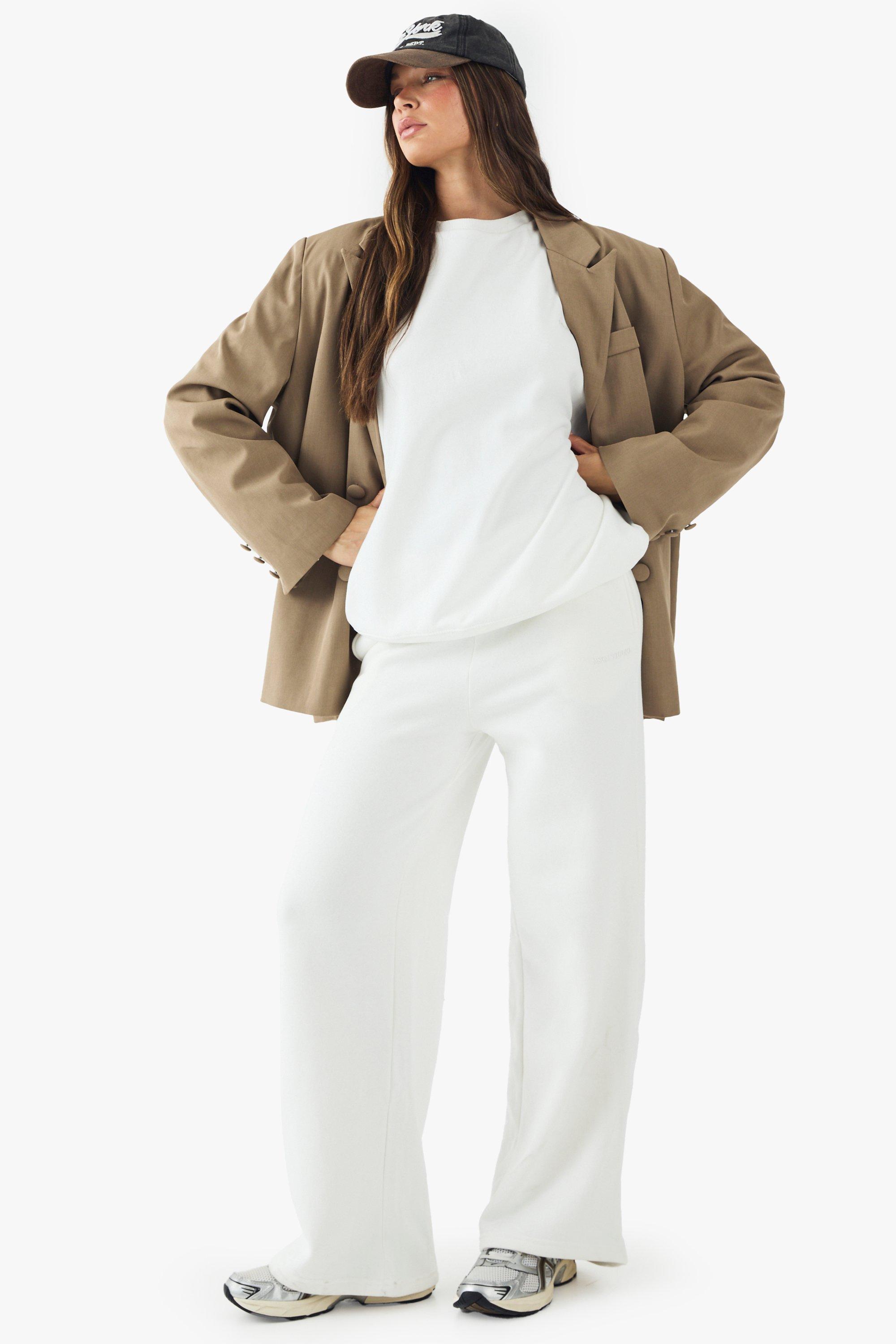 Image of Pantaloni tuta dritti con ricamo Dsgn Studio, Cream