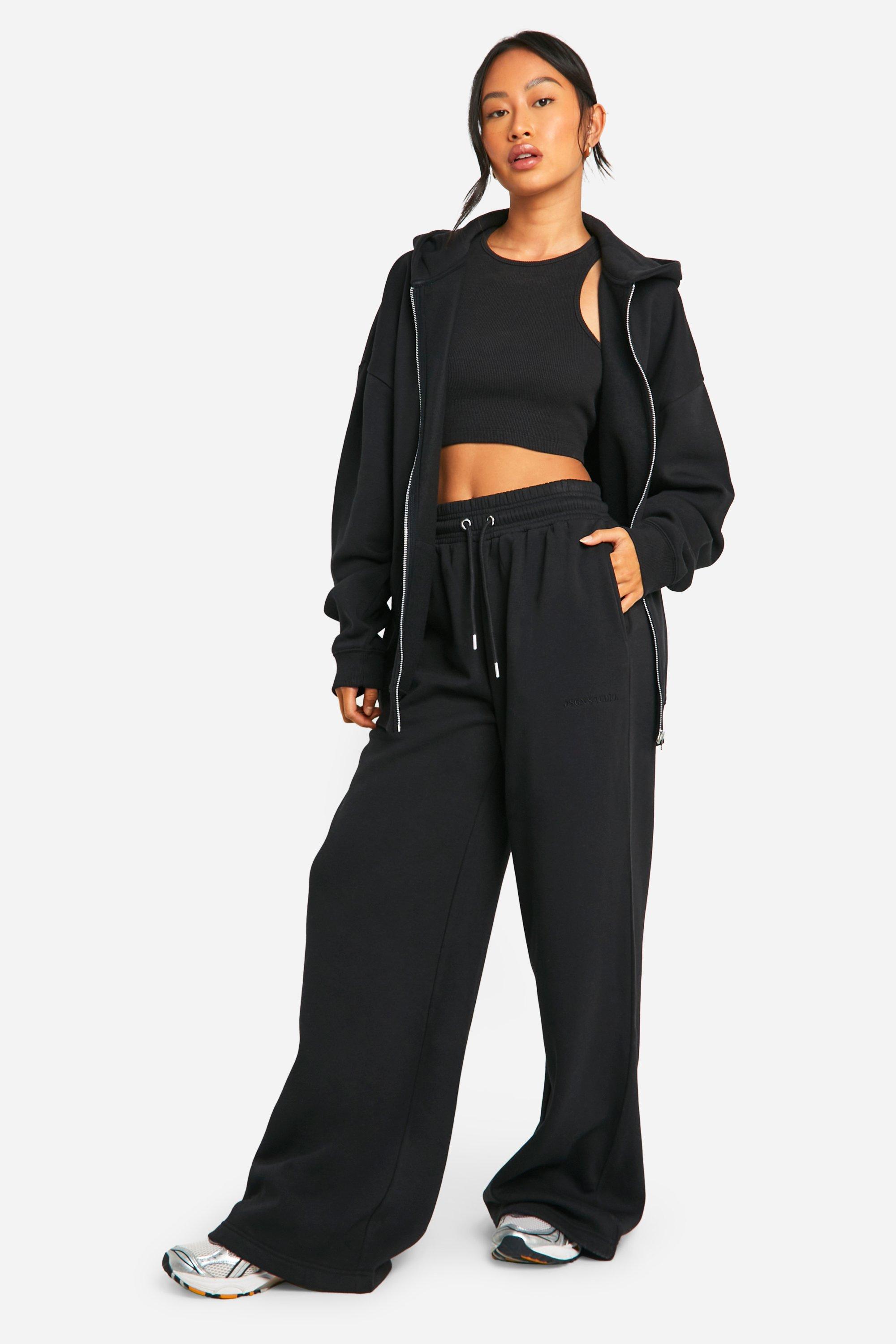 Image of Pantaloni tuta a gamba ampia con ricami Dsgn Studio, Nero