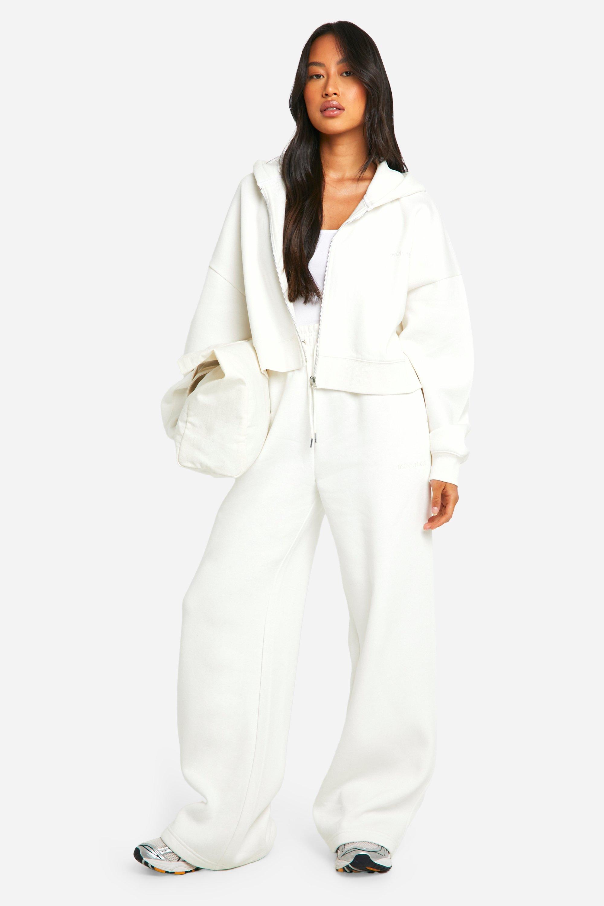 Image of Pantaloni tuta a gamba ampia con ricami Dsgn Studio, Cream