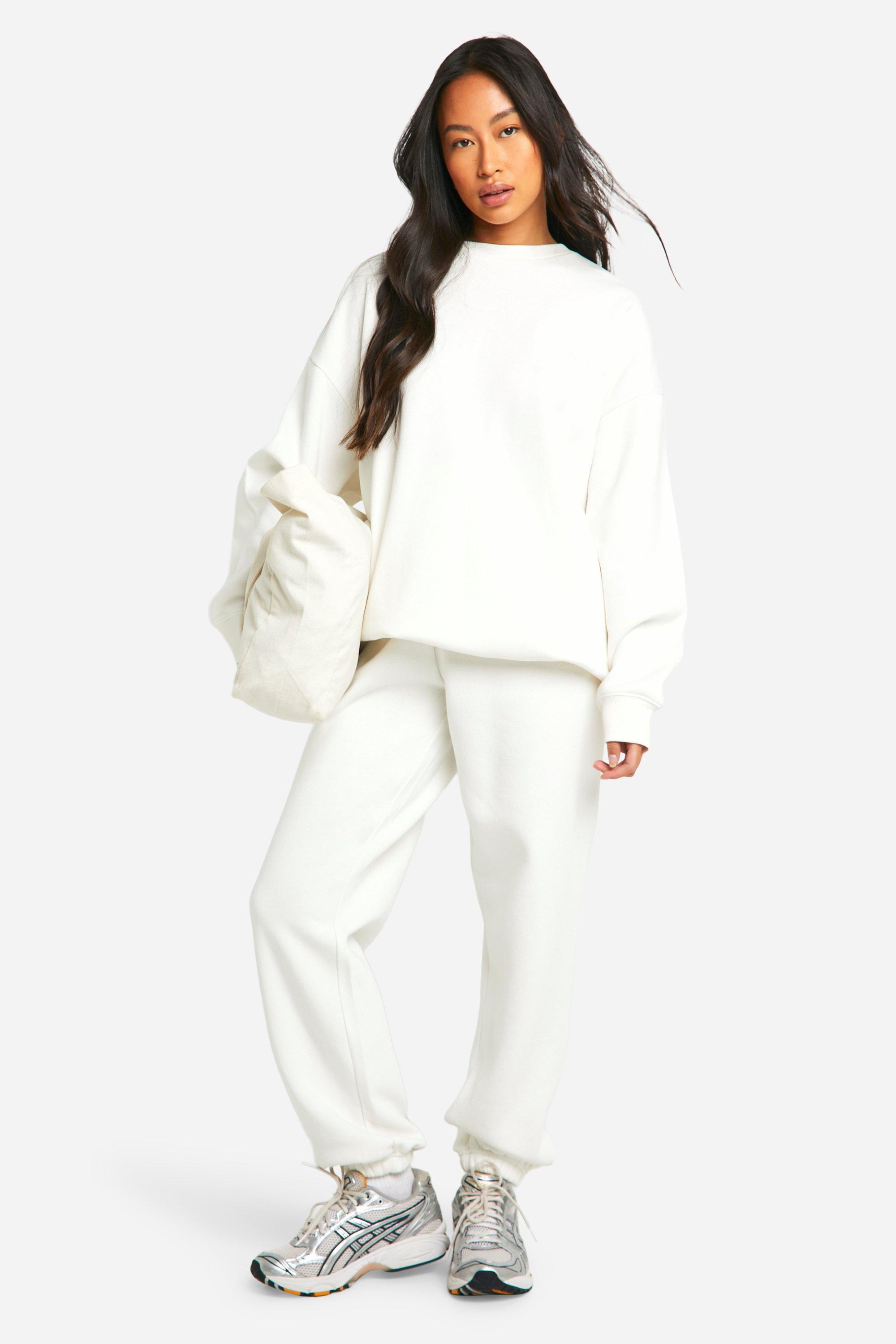Image of Pantaloni tuta oversize Dsgn Studio con ricami e polsini alle caviglie, Cream
