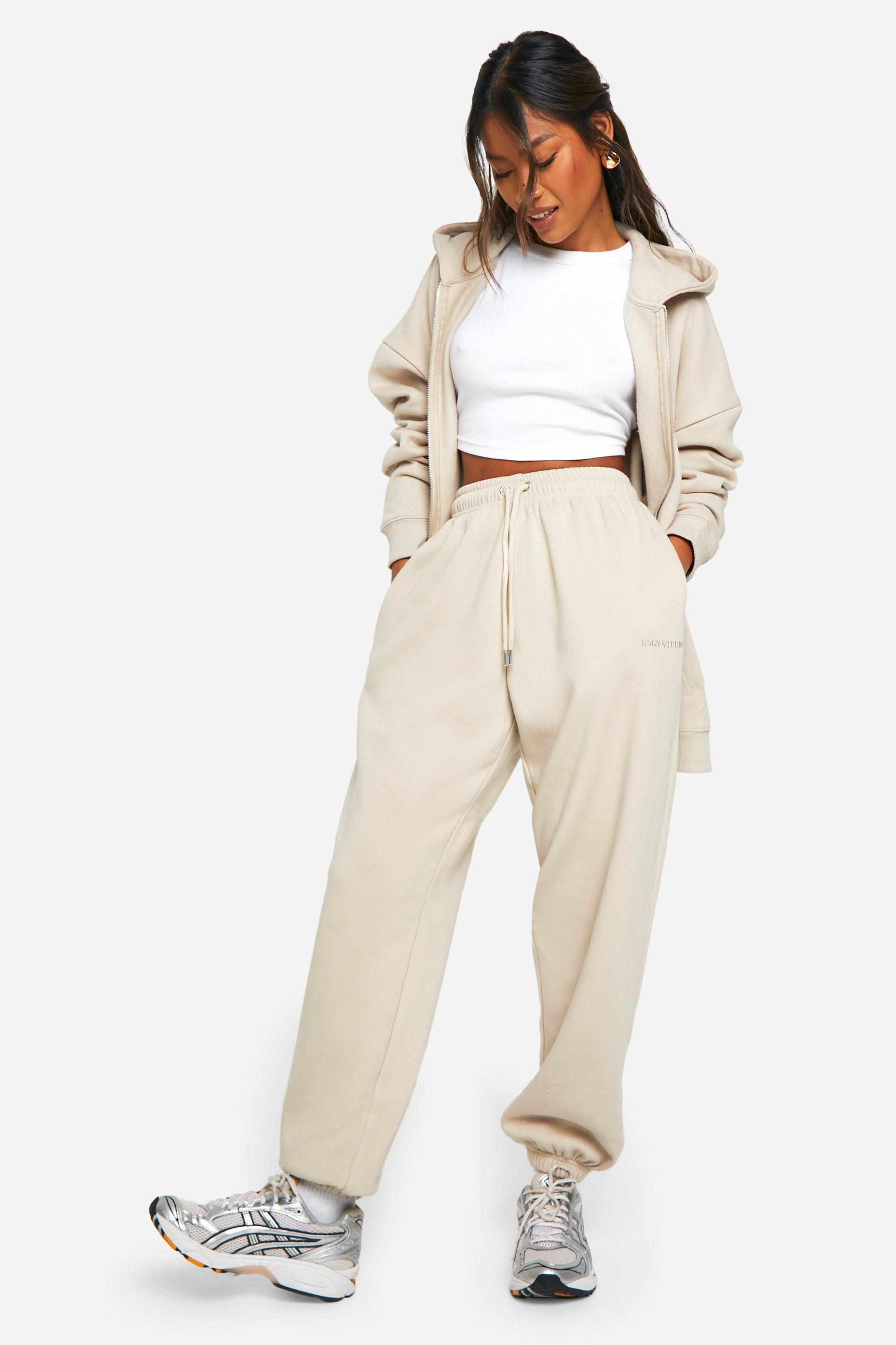Image of Pantaloni tuta oversize Dsgn Studio con ricami e polsini alle caviglie, Beige