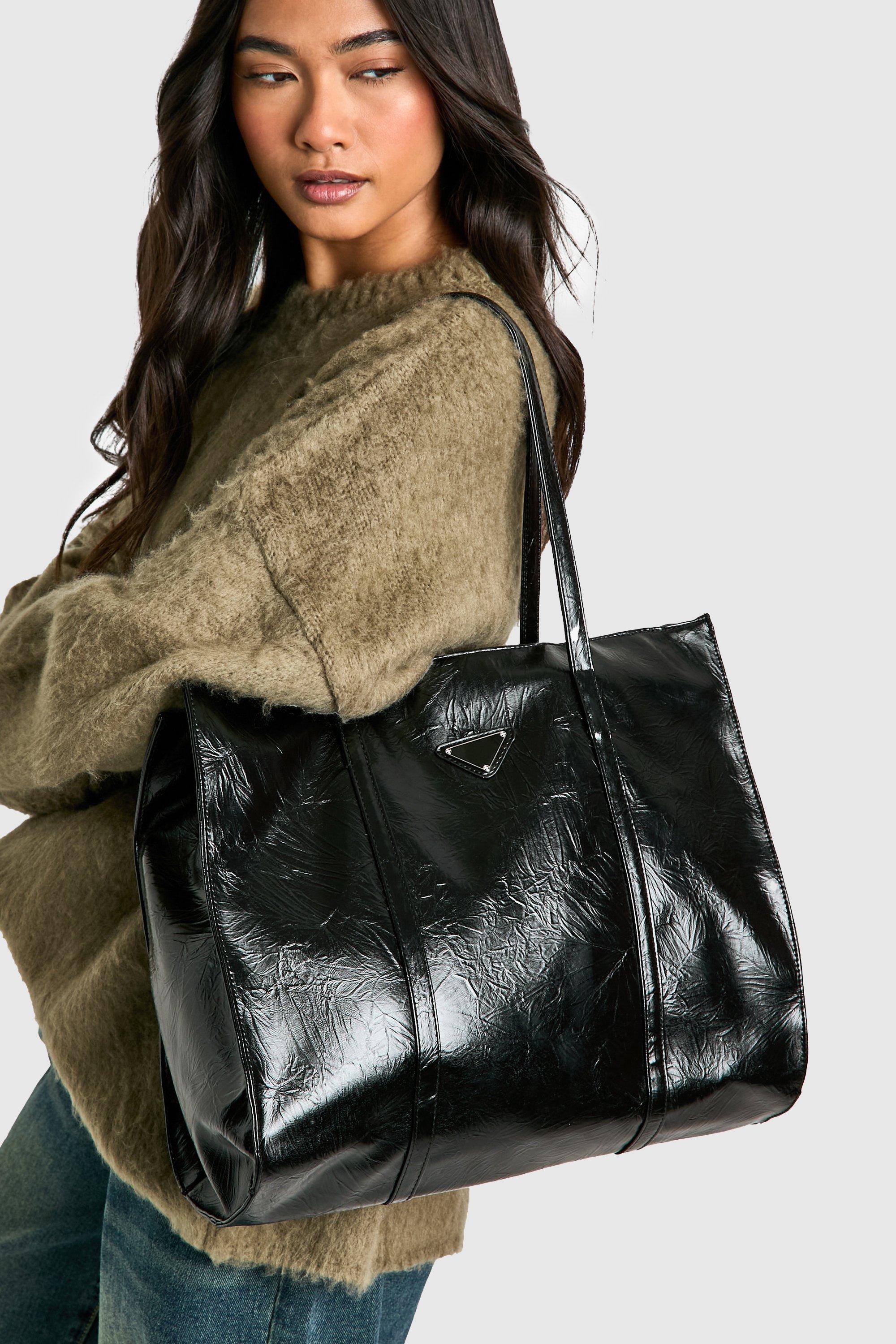 Click to view product details and reviews for Womens Triangle Trim Textured Pu Tote Bag Black One Size Black.