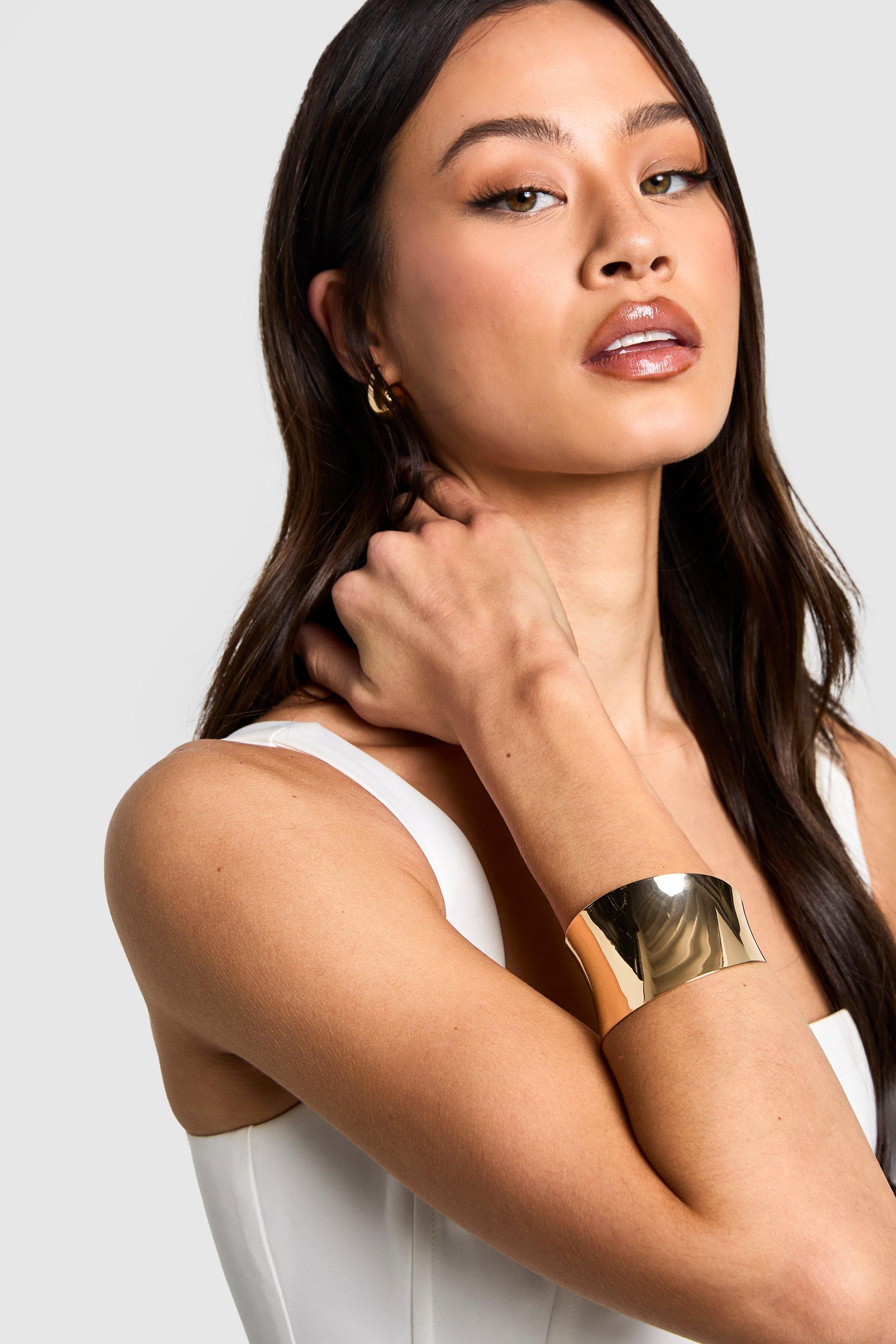 Image of Bracciale rigido rigido spazzolato color oro, Metallics