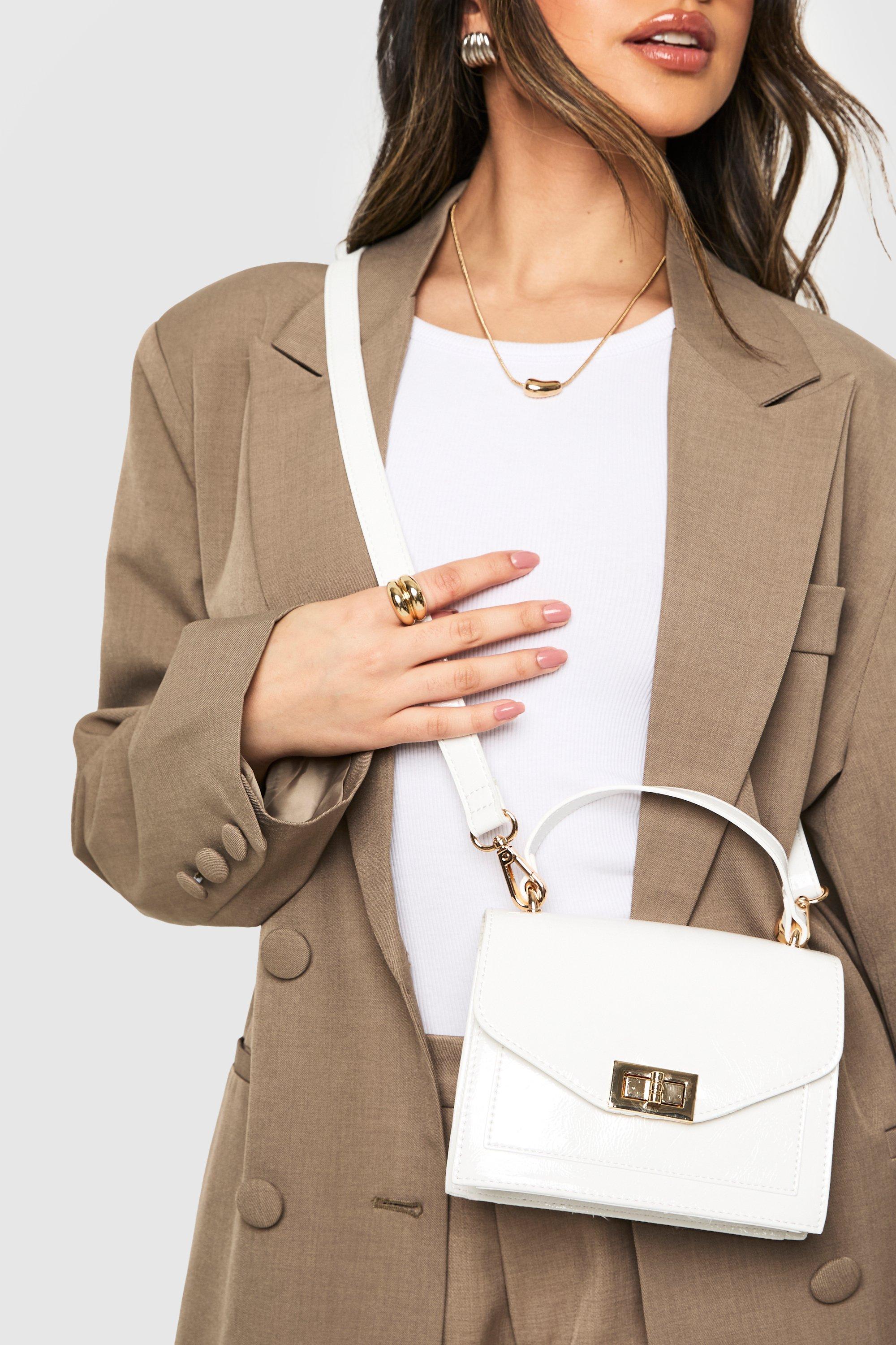 Click to view product details and reviews for Womens Structured Patent Cross Body Bag White One Size White.
