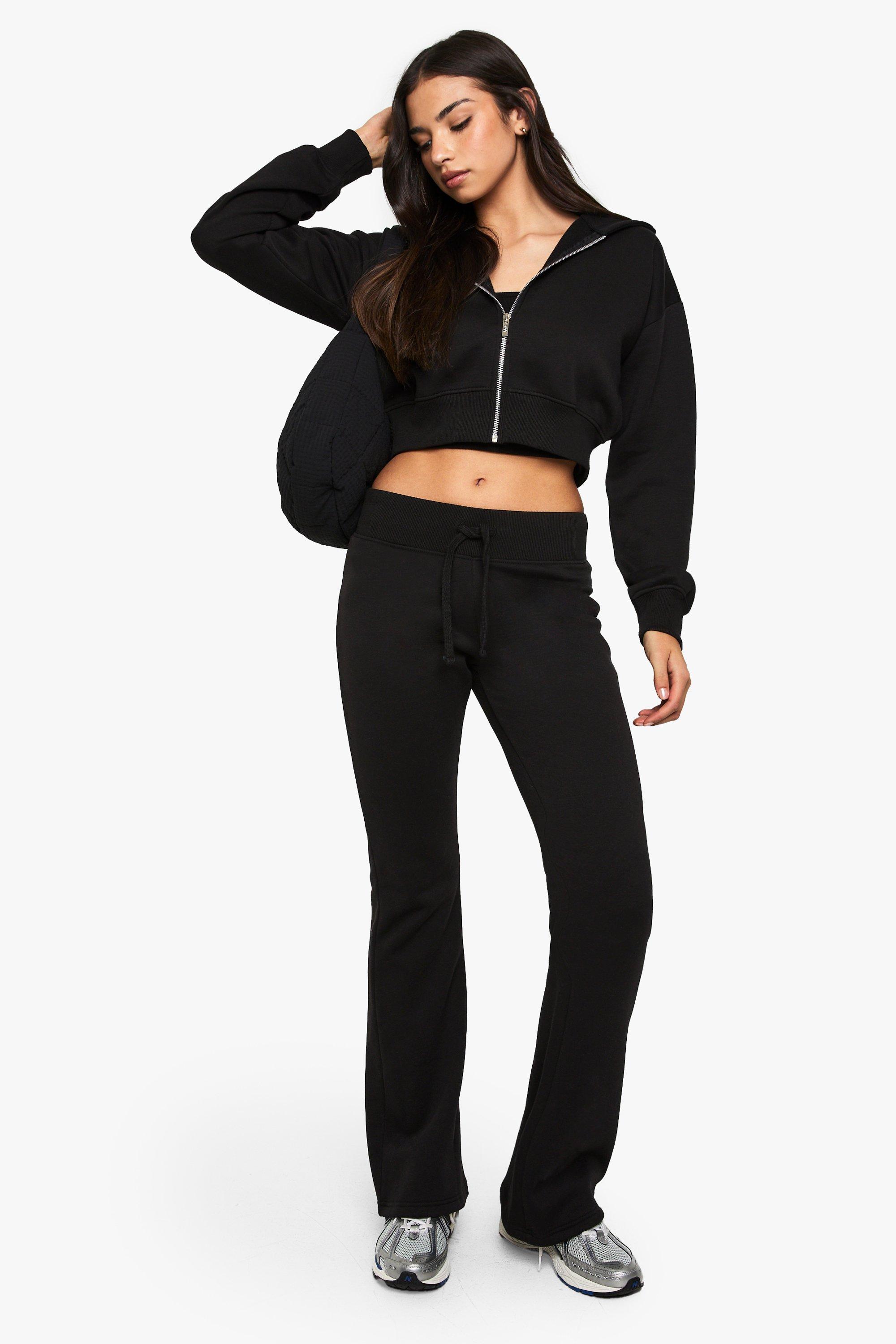 Image of Tuta sportiva in 3 pezzi con pantaloni tuta a zampa e pantaloni ristretti, Nero