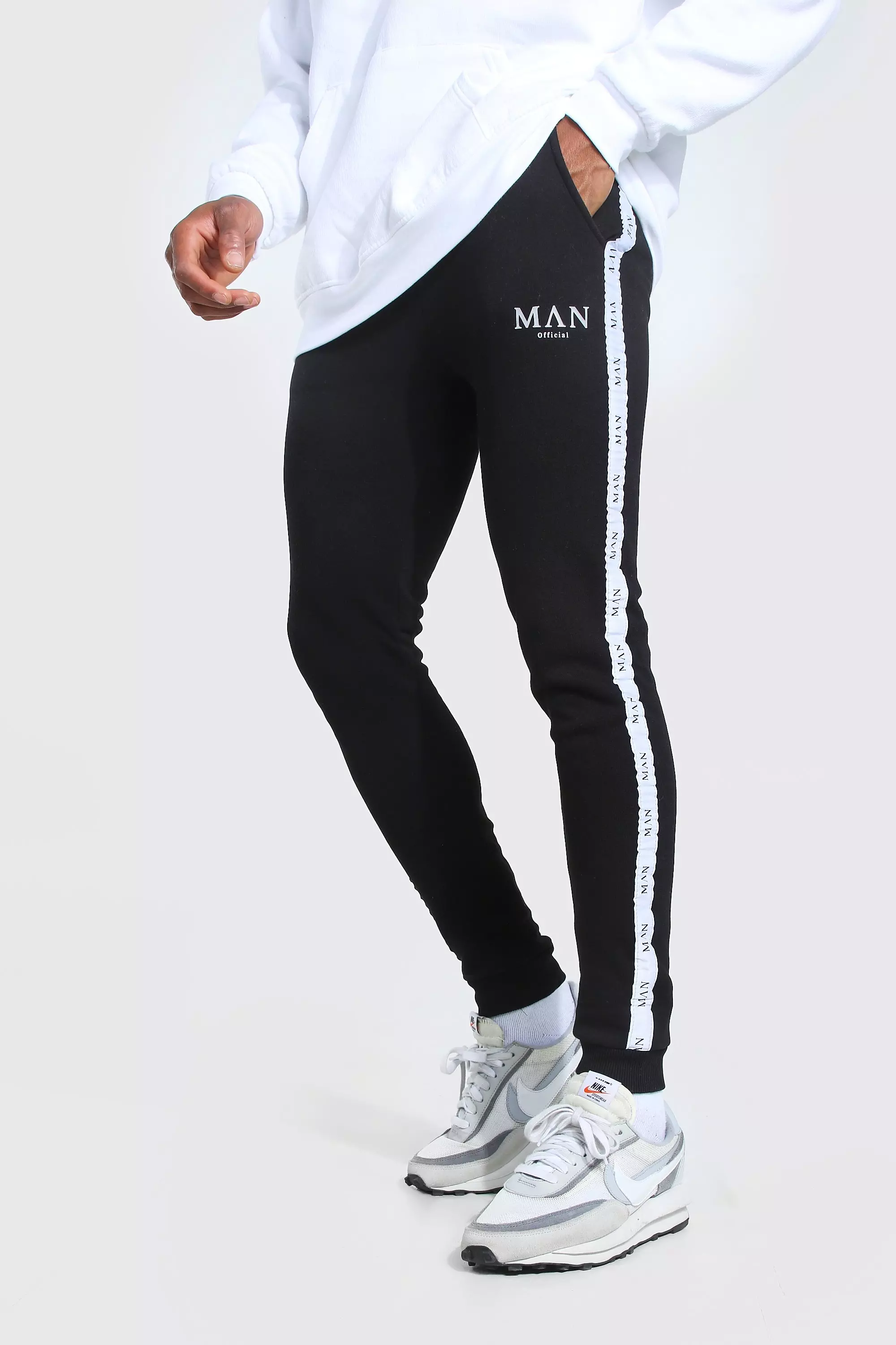 Nike taping skinny outlet fit joggers in black