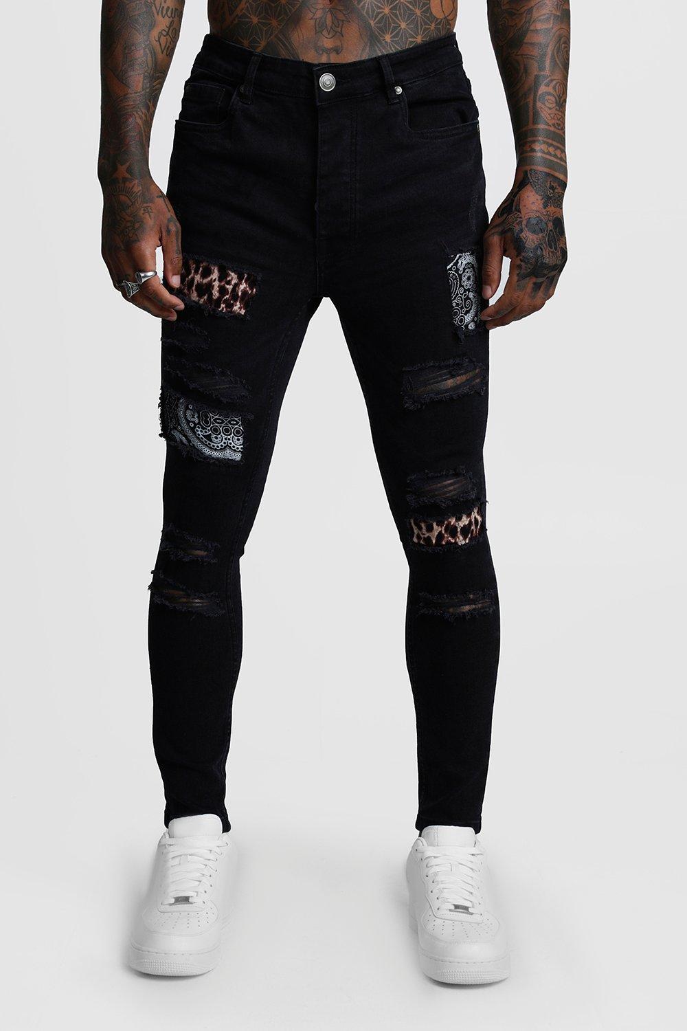 ripped jeans with black patches