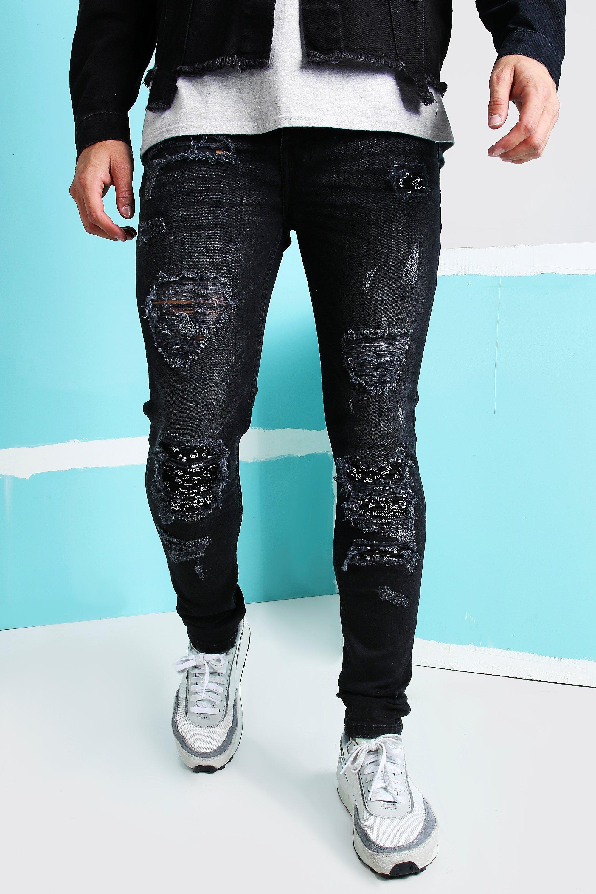 black ripped and repaired jeans