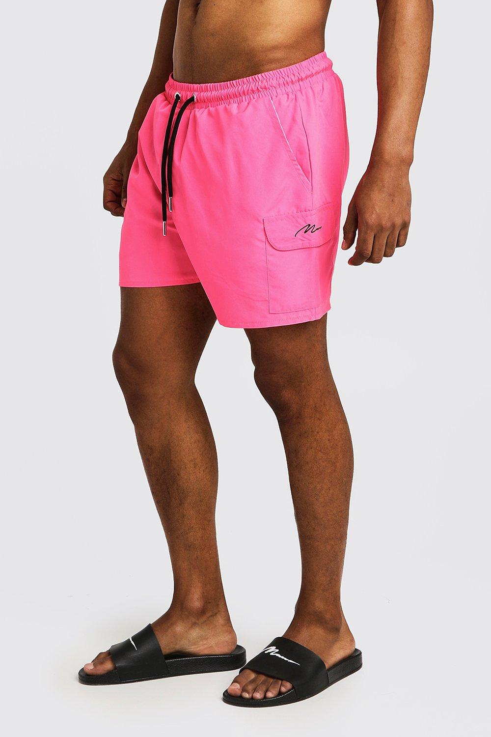 neon pink swim shorts