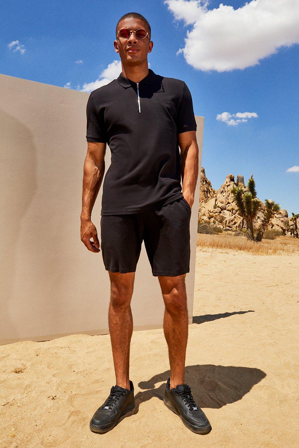 black polo and shorts