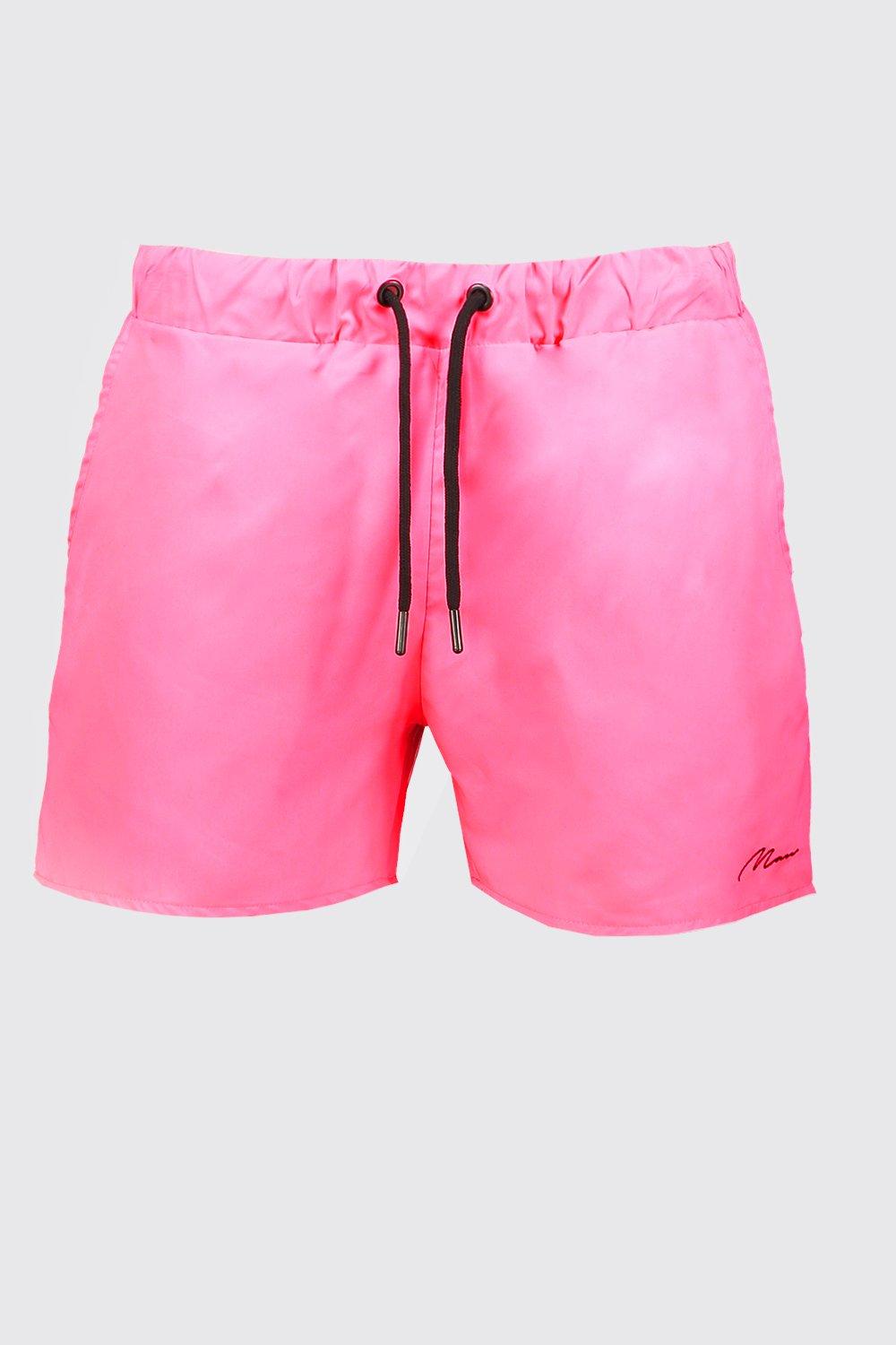 neon pink swim shorts