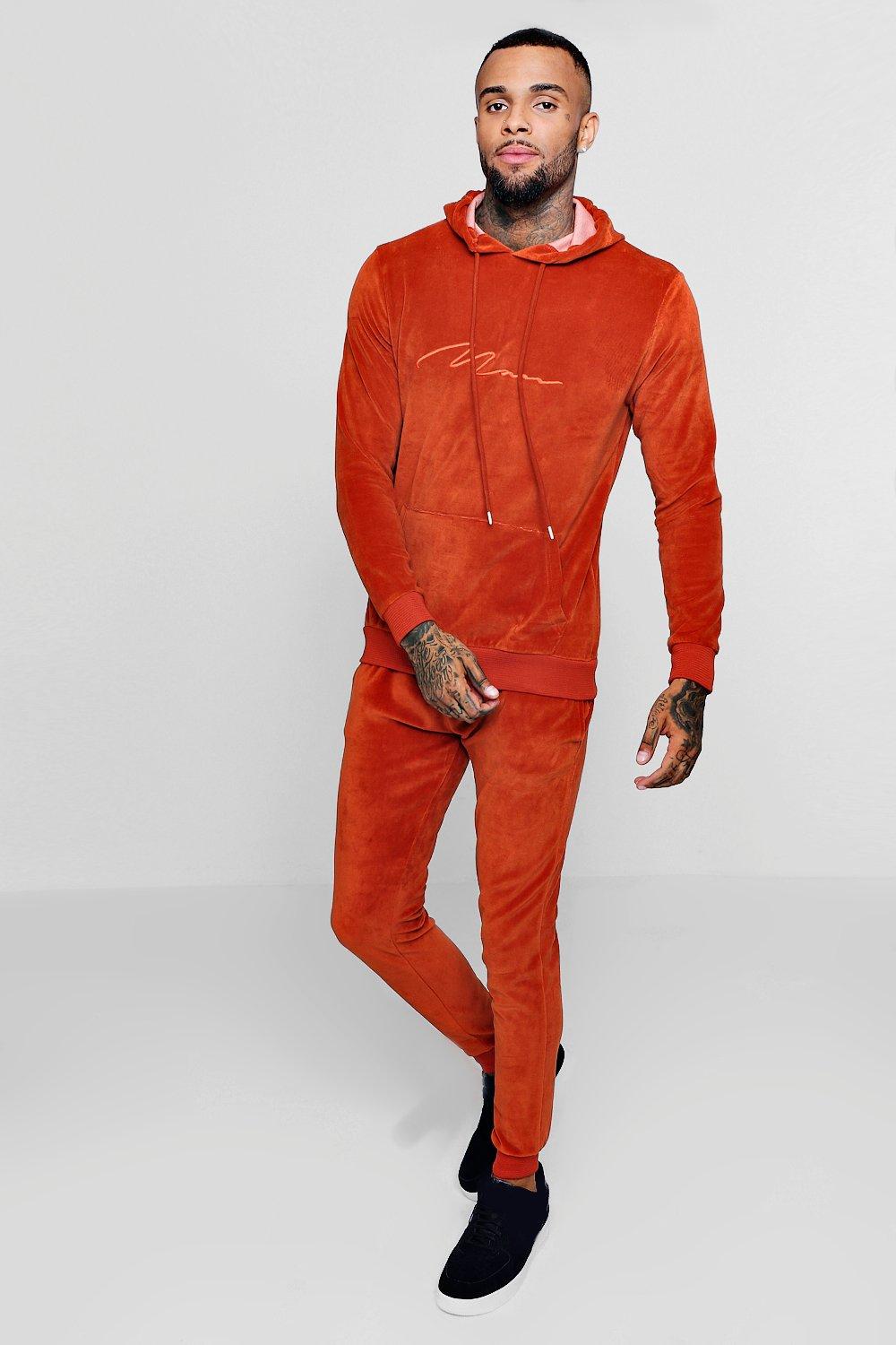 orange velour tracksuit