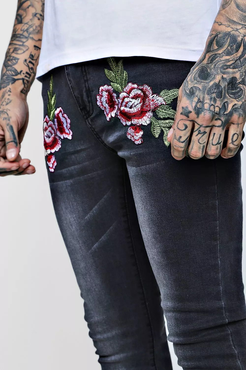 Black jeans store with rose embroidery