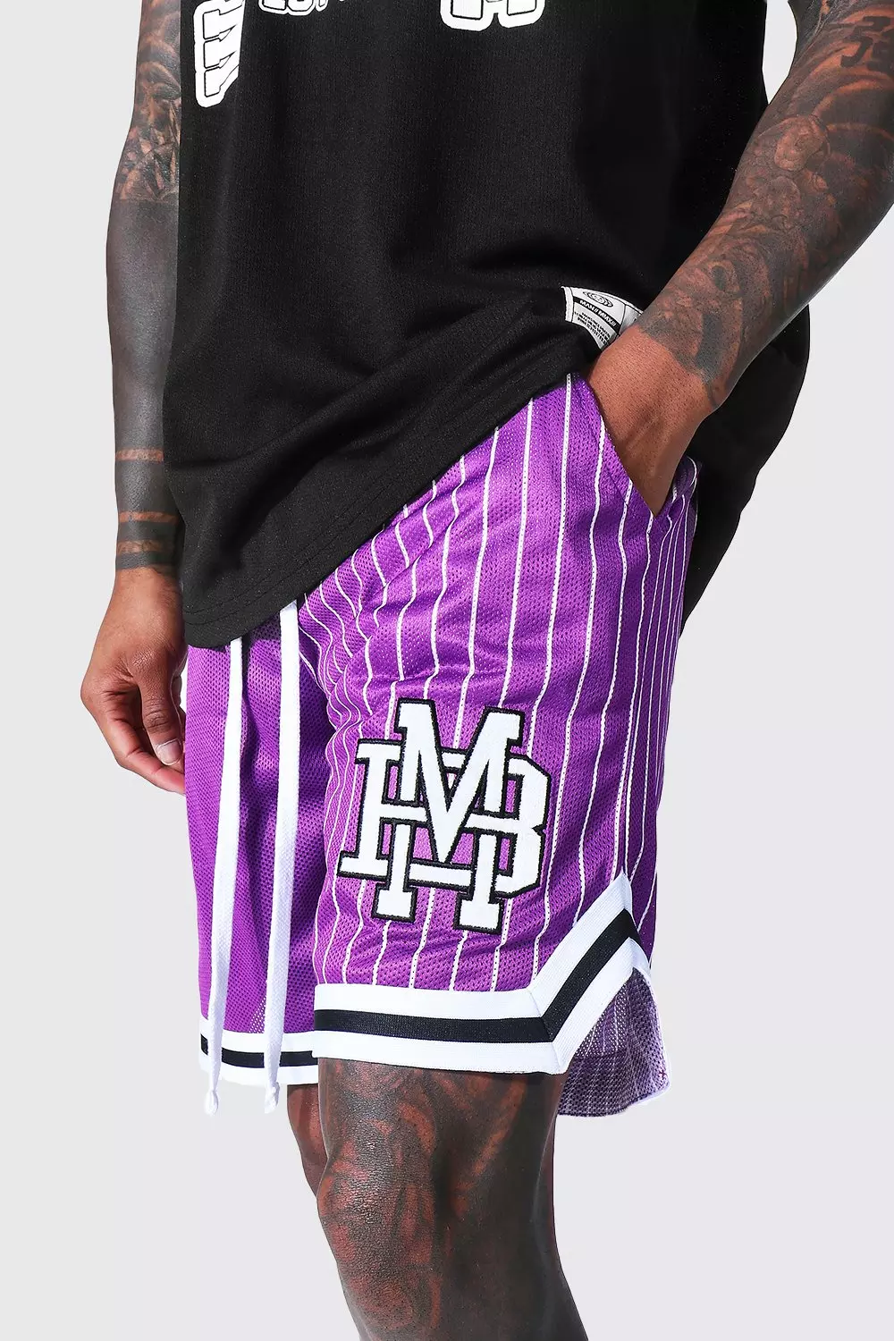 Mitchell & Ness NBA Toronto Raptors mesh swingman shorts in purple