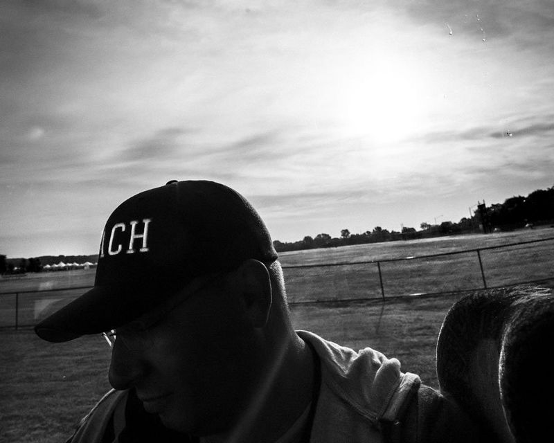 En route to a match, Muddy York Rugby Football Club head coach and player Eric DeMarbre prepares the team’s line-up for the Bingham Cup opener.