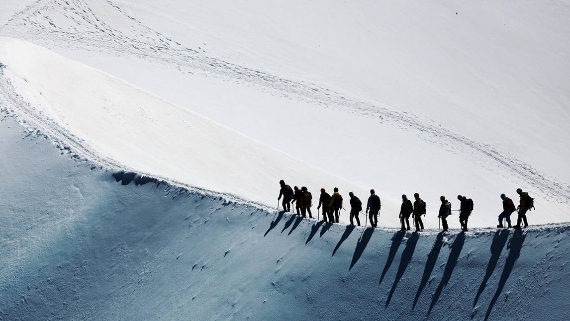 Group of people on a hike in the snow
