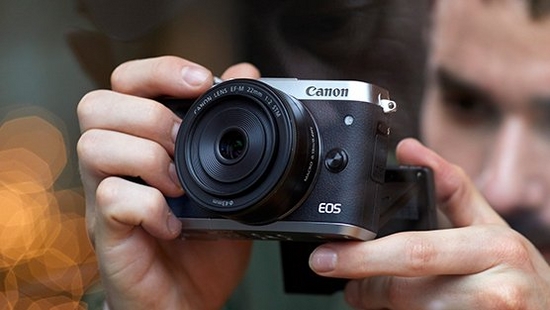 Image of a Male shooting with a Canon consumer camera