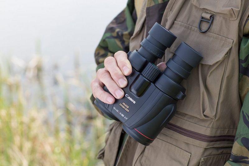 Man holding a binocular for birdwatching