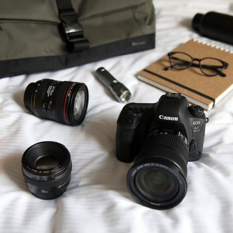 Canon EOS 6D Mark II Body Camera On Bed With Two Other Lenses