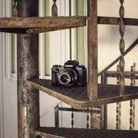 Canon PowerShot G1 X Mark III Camera on a metal staircase