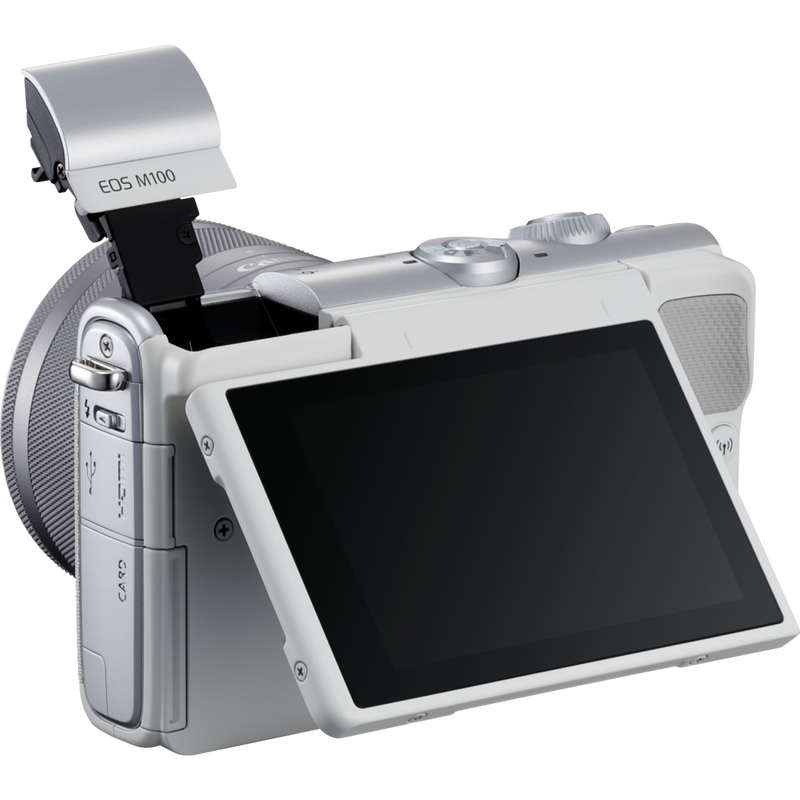 Canon EOS M100 White + EF-M 15-45mm f/3.5-6.3 IS STM Lens Silver Product Diagonal Back View with Built-in Flash and Tilted Screen