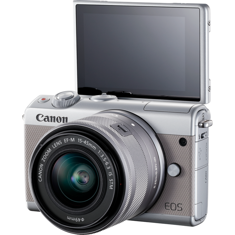 Canon EOS M100 Grey + EF-M 15-45mm f/3.5-6.3 IS STM Lens Silver Product Diagonal View with Tilted Screen