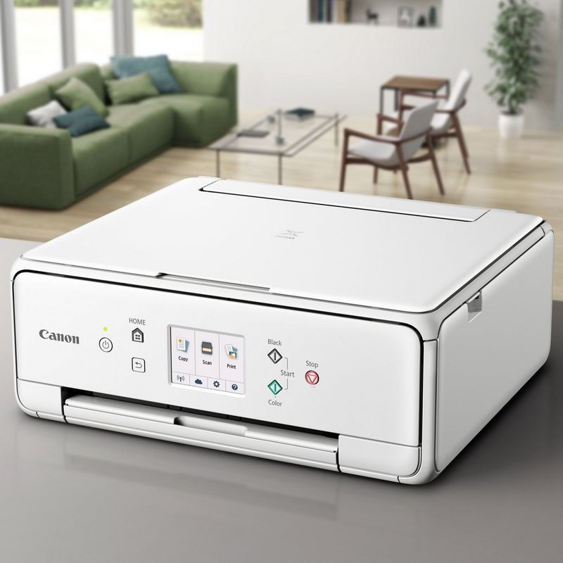 Canon PIXMA TS6151 - White  Placerad på ett bord i ett hus