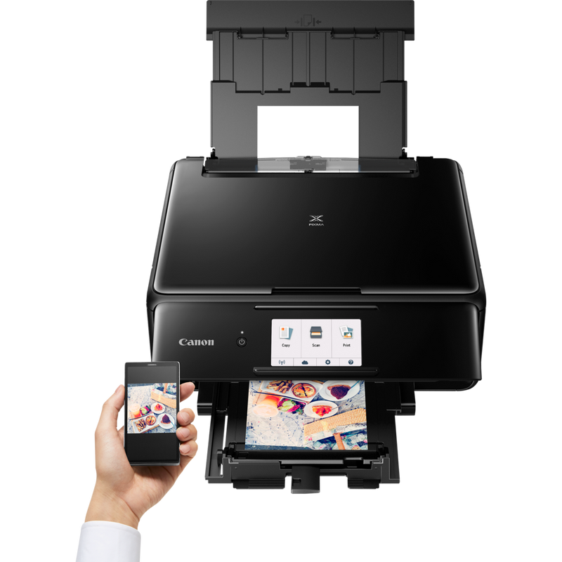 Canon PIXMA TS8150 - Black Product Front View With A Person Printing From a Smartphone
