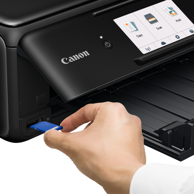 Canon PIXMA TS8150 - Black Product Front View With A Person Inserting A Memory Card