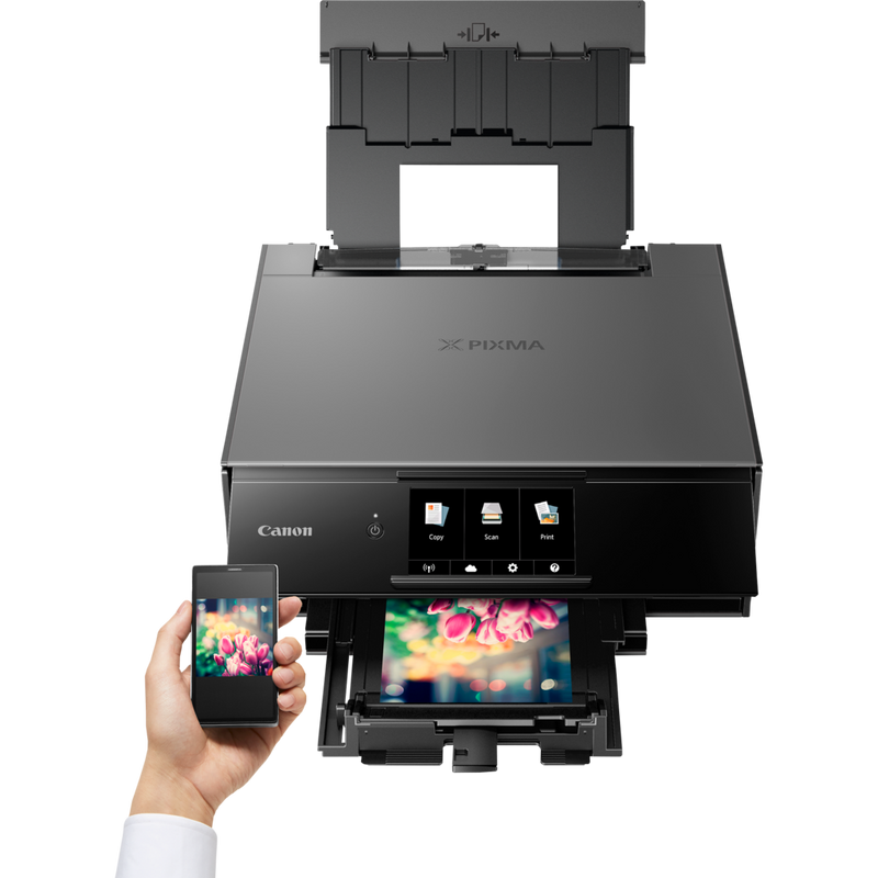 Canon PIXMA TS9140 - Dark Grey Product Front View With A Person Printing From a Smartphone