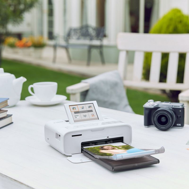 Canon SELPHY CP1300 Colour Portable Photo Printer - White Printer on Desk with camera and teacup