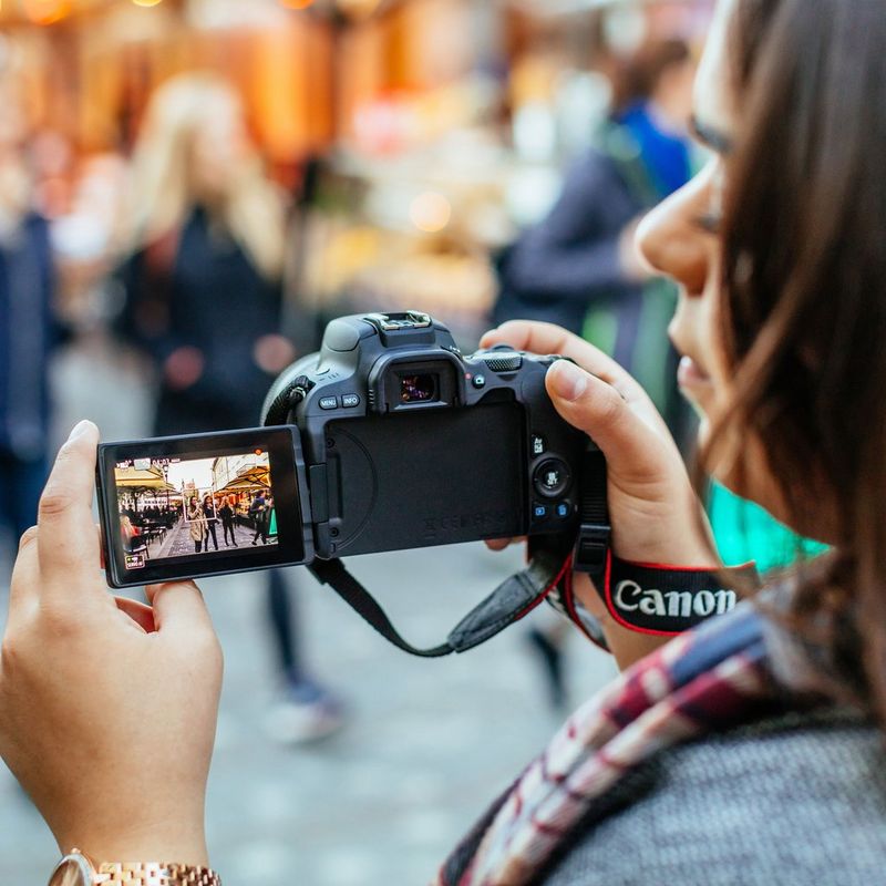 Canon EOS 200D Black + EF-S 18-55mm f/3.5-5.6 III Lens Woman Holding Camera To Take A Photo