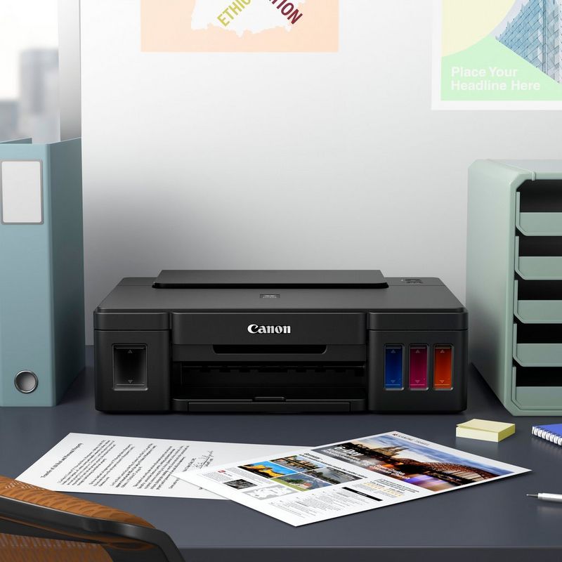 Canon PIXMA G1510 Refillable MegaTank Printer Kept On A Office Table Beside A CPU