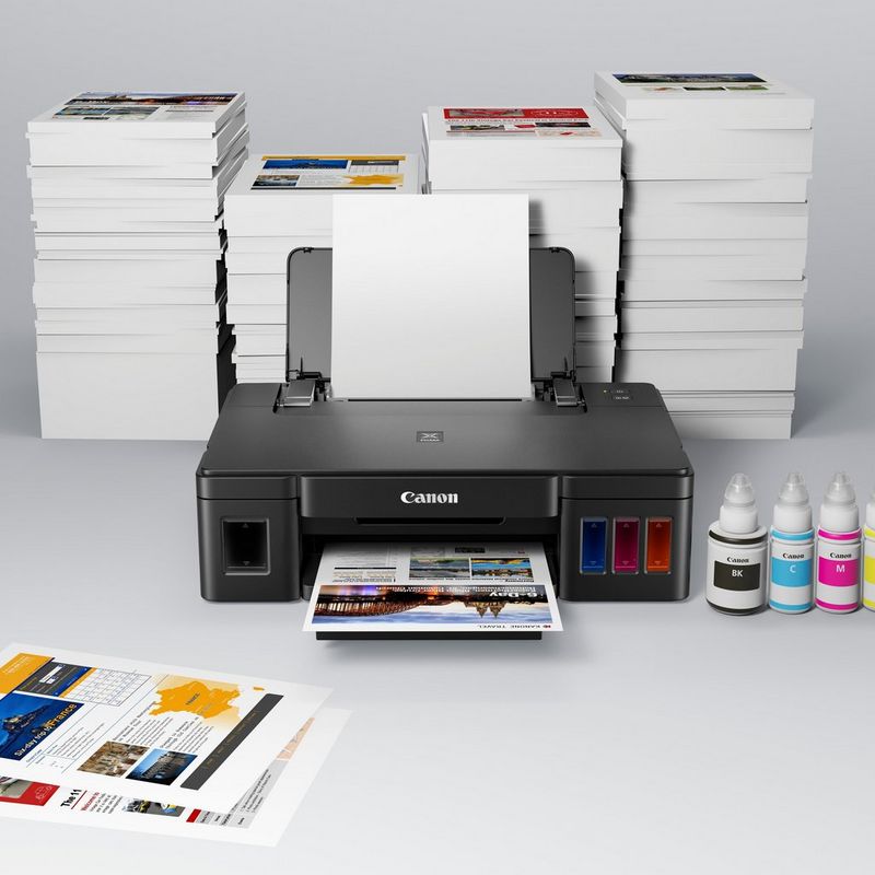 Canon PIXMA G1510 Refillable MegaTank Printer Kept On A Table Along with the Ink Bottles