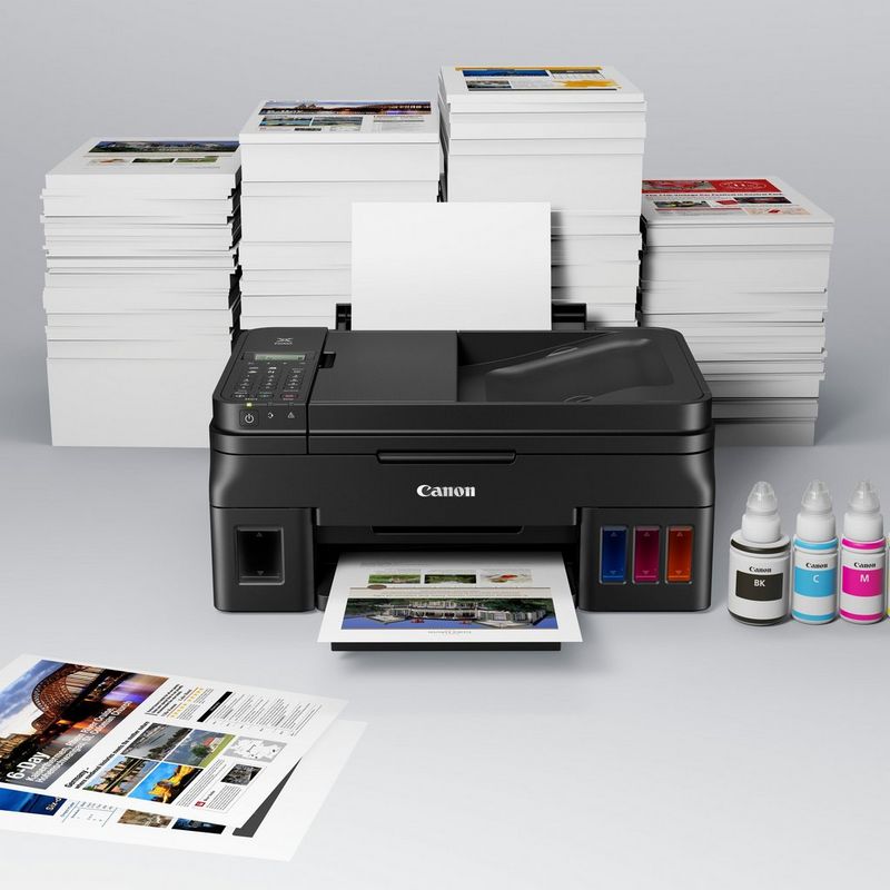 Canon PIXMA G4510 Refillable MegaTank Printer Kept On A Table Along with the Ink Bottles
