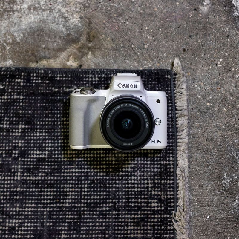 Canon EOS M50 White + EF-M 15-45mm IS STM Lens Silver The Camera on a Rug