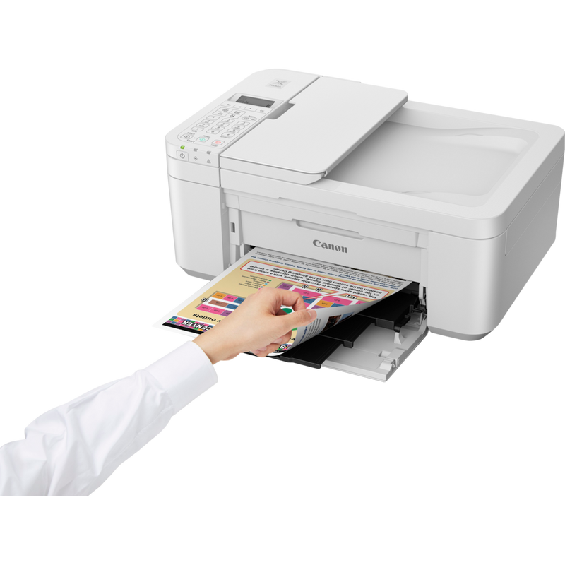 Canon PIXMA TR4551 4-In-One printer, White Product Front Slant View With A Person Checking the Printout