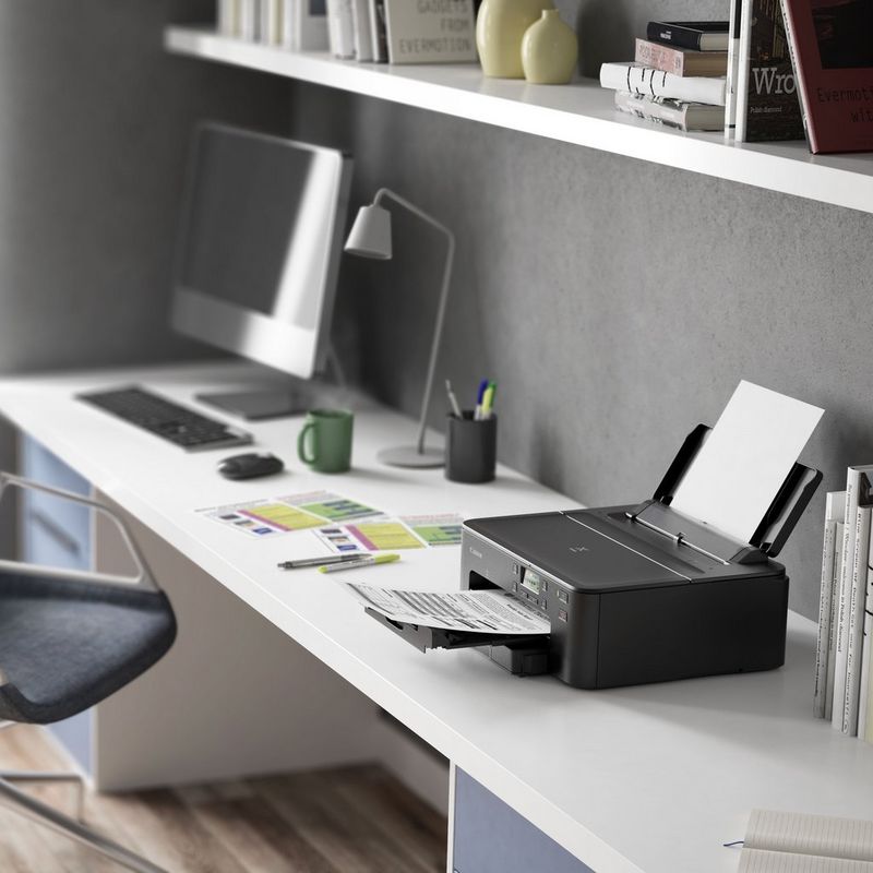 Canon PIXMA TS705 Inkjet Printer Kept On A Office Table Beside a Monitor