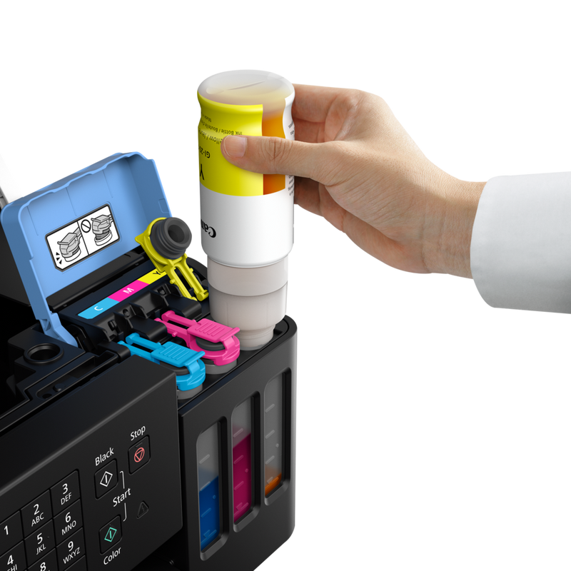 Canon PIXMA G7050 Refillable MegaTank Inkjet Printer Product Front View with A Person Refilling the Yellow Ink Tank