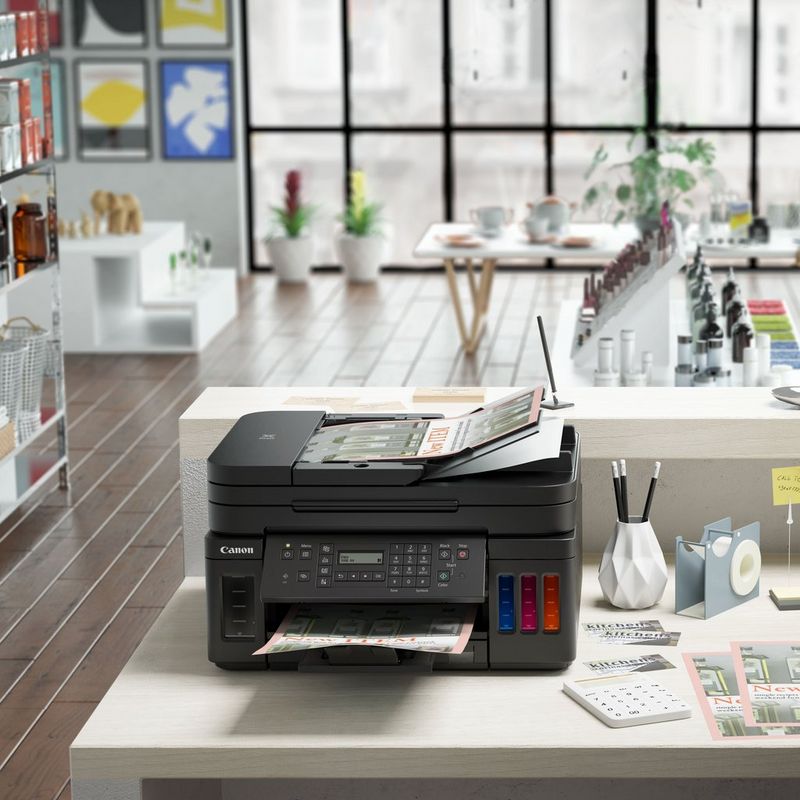 Canon PIXMA G7050 Refillable MegaTank Inkjet Printer Kept On A Table With Paper Tray Out