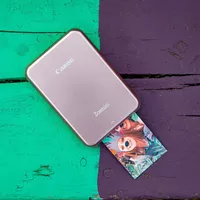 Canon Zoemini Portable Colour Photo Printer, Rose Gold Printer with Print Out on colorful desk