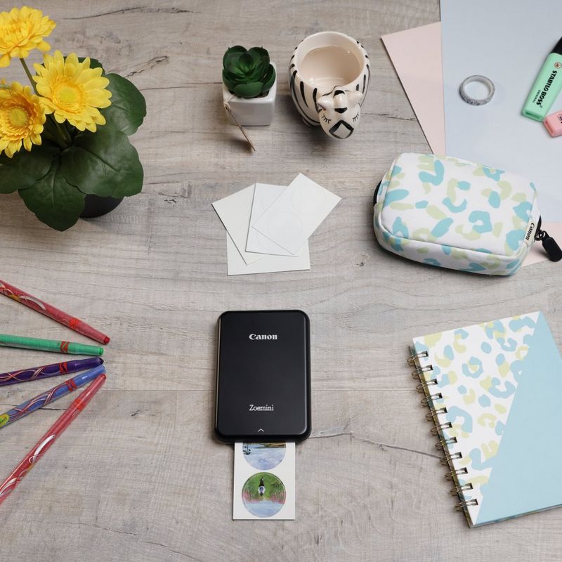 Canon Zoemini Portable Colour Photo Printer, Black + Diary + Pouch Printer positioned on Desk and Pens