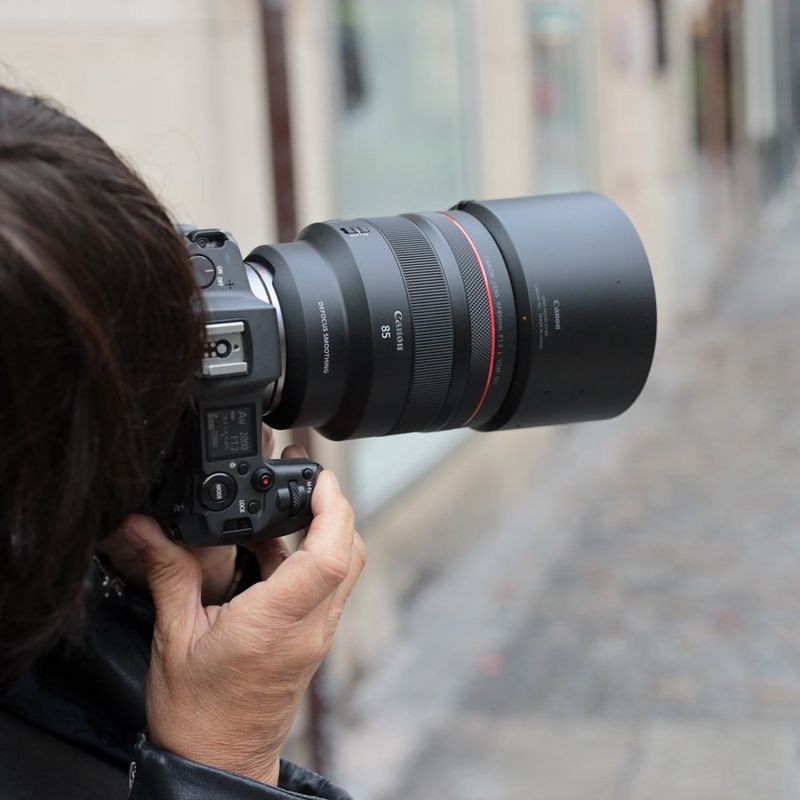 Canon RF 85mm F1.2L USM DS Lens A Woman Holing a Camera to Her Face